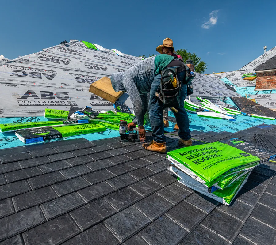 A roofing crew working on a residential project